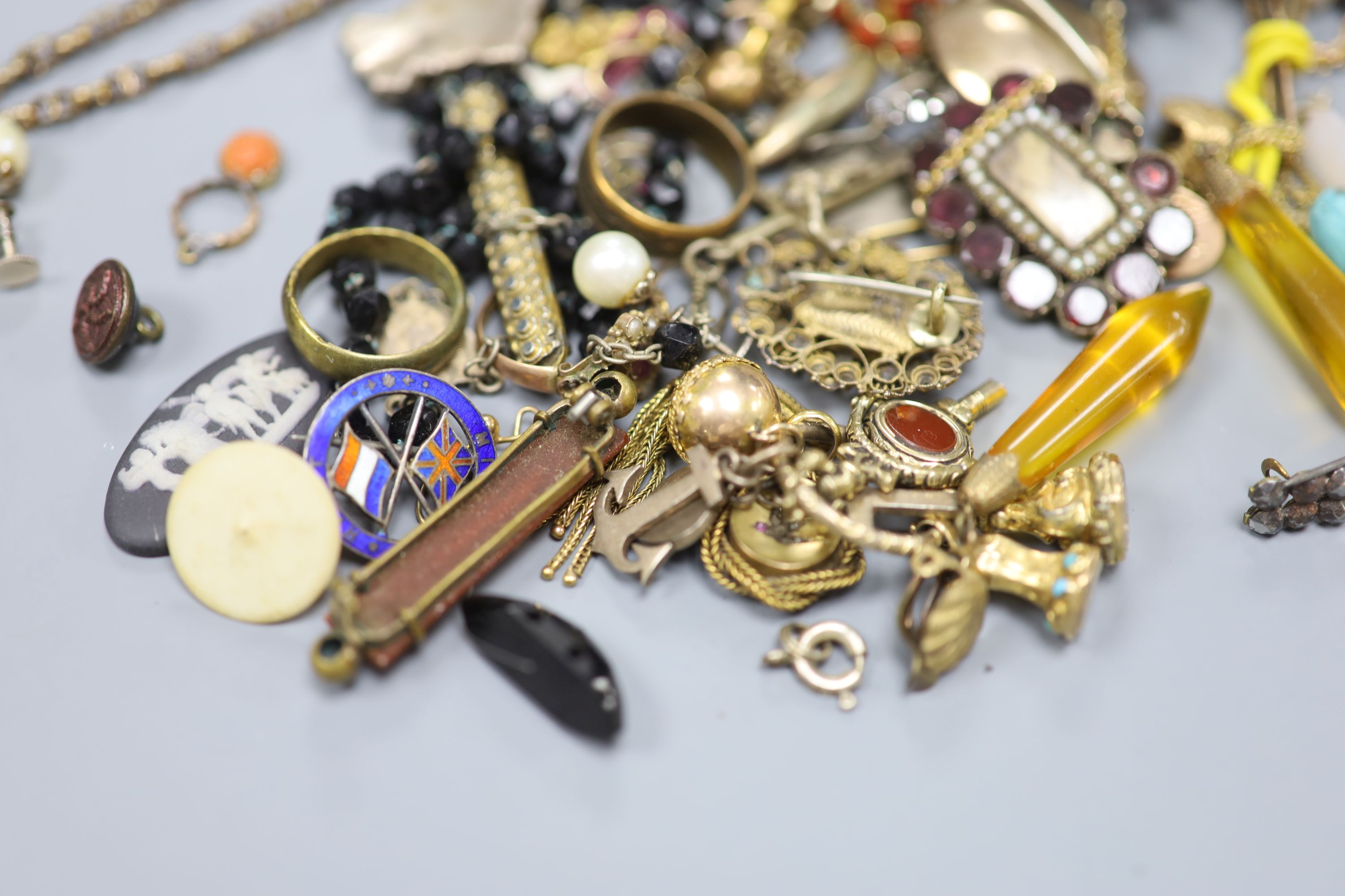 A quantity of assorted mainly 19th century jewellery including mourning brooches, fob seal, stick pins, etc.